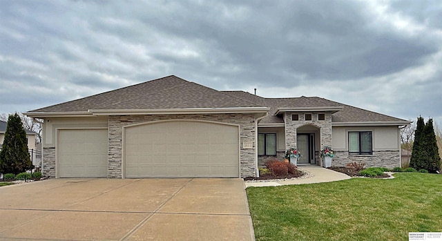 view of front of house featuring roof with shingles, a front lawn, driveway, stone siding, and a garage
