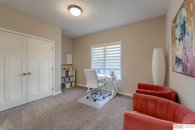 home office featuring carpet floors and baseboards