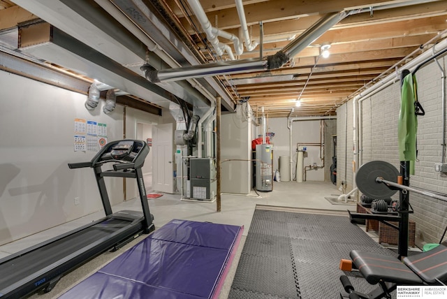 workout area with heating unit and gas water heater