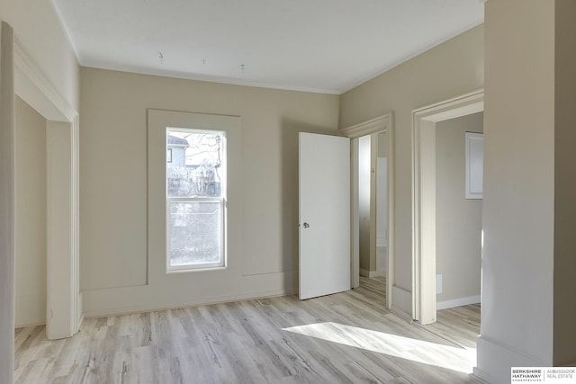 unfurnished bedroom with baseboards and wood finished floors