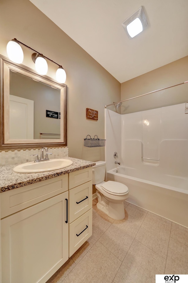 full bath featuring shower / bathtub combination, toilet, and vanity