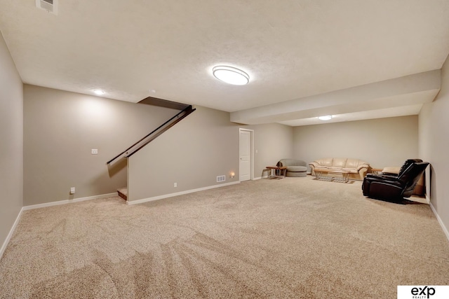 unfurnished room featuring stairs, carpet flooring, baseboards, and visible vents
