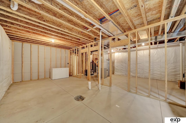 unfinished below grade area with fridge