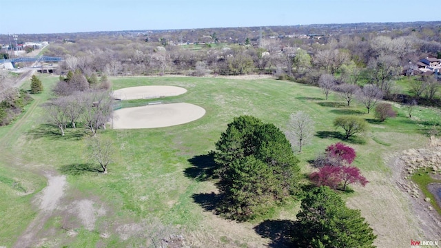 birds eye view of property with golf course view