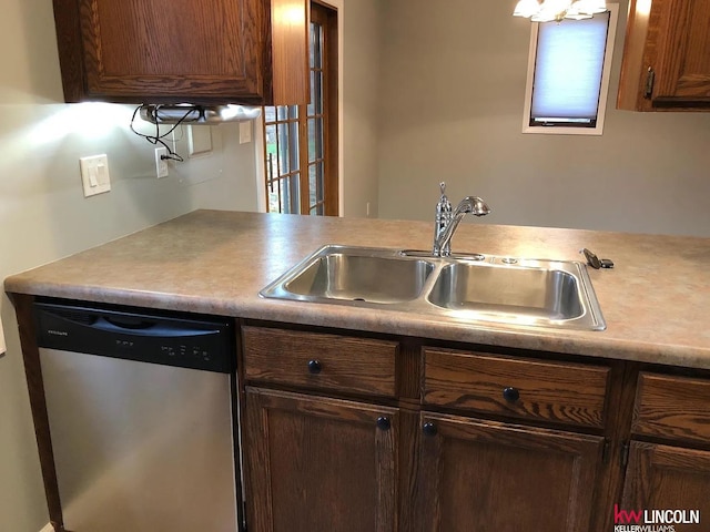 kitchen with light countertops, dishwasher, a healthy amount of sunlight, and a sink