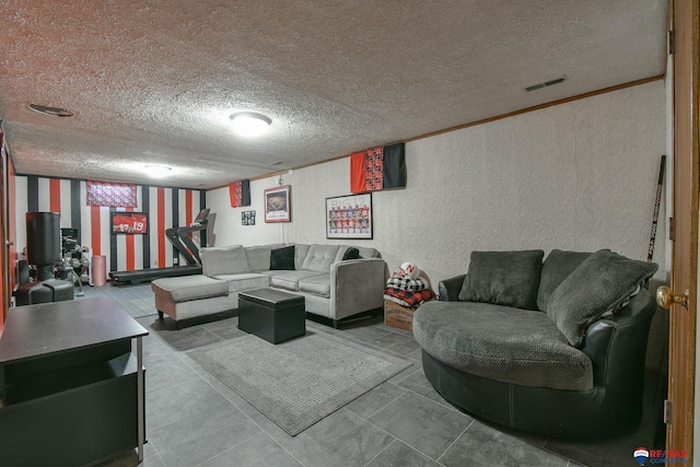 living area featuring a textured wall, visible vents, and a textured ceiling
