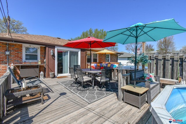 wooden deck featuring outdoor dining space