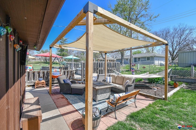 view of patio featuring a fire pit and fence