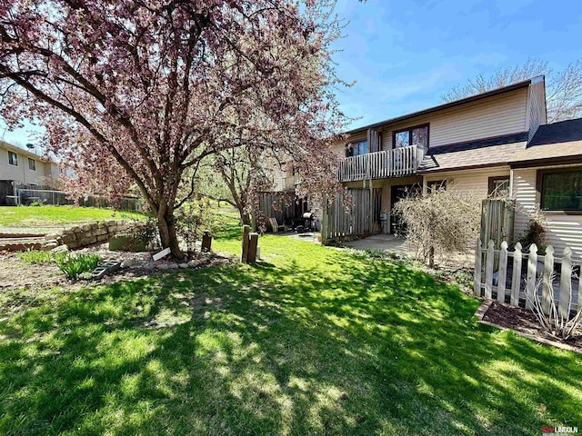 2219 Southwood Pl, Lincoln, NE 68512 - view of yard featuring a balcony