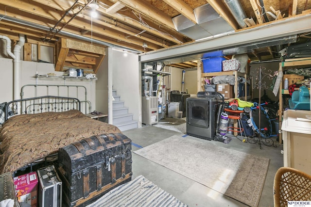 unfinished below grade area featuring separate washer and dryer