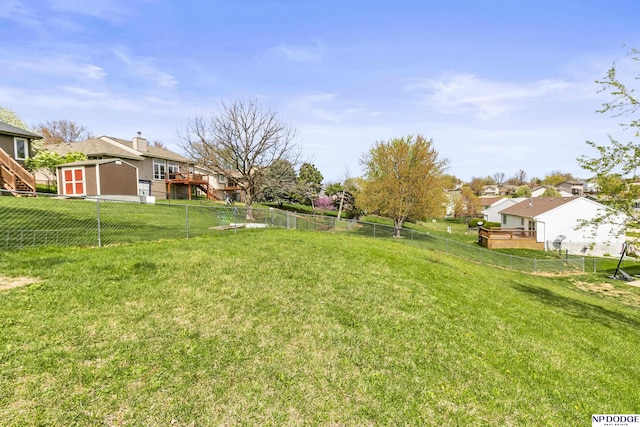 view of yard with a fenced backyard and a residential view