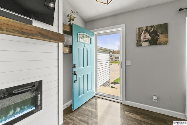 interior space with baseboards and wood finished floors