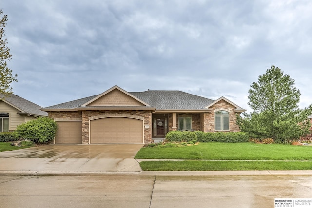 single story home featuring roof with shingles, stone siding, a garage, a front yard, and concrete driveway