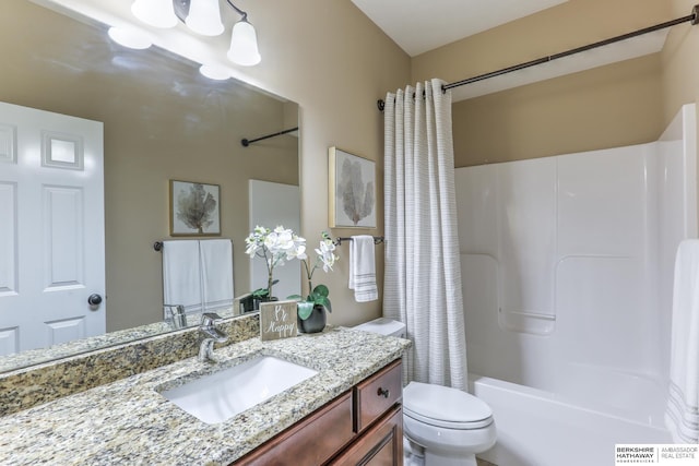 bathroom featuring vanity, toilet, and shower / tub combo with curtain