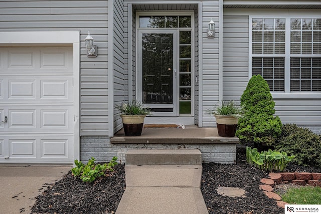 doorway to property featuring a garage