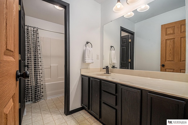 full bathroom featuring vanity, tile patterned floors, and shower / bath combo with shower curtain