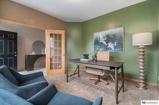 office featuring baseboards and carpet flooring