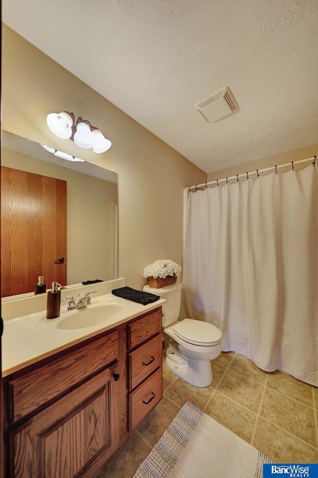full bath featuring toilet, tile patterned floors, visible vents, and vanity