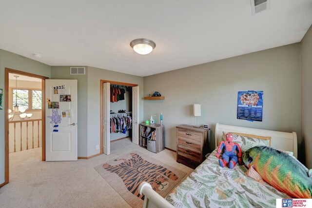 bedroom featuring carpet floors, a closet, and baseboards