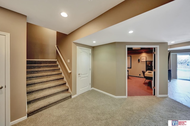 stairs with carpet, recessed lighting, and baseboards