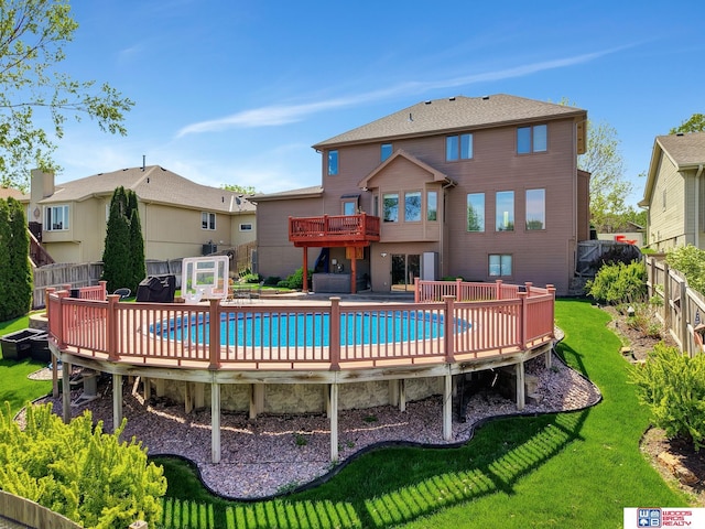 rear view of house featuring a deck