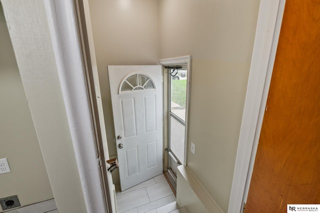 interior space with light tile patterned floors