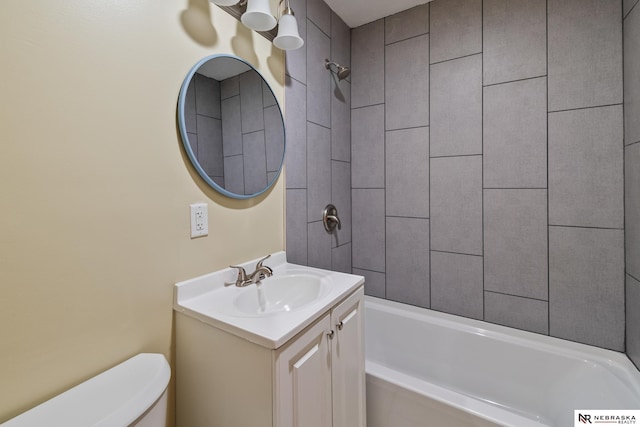 full bathroom featuring toilet, tub / shower combination, and vanity