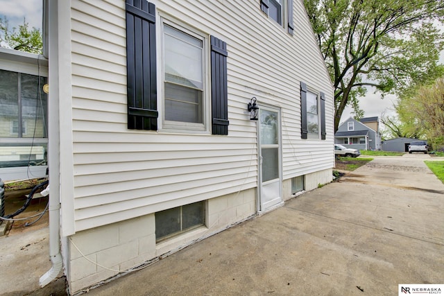 view of side of property featuring a patio area