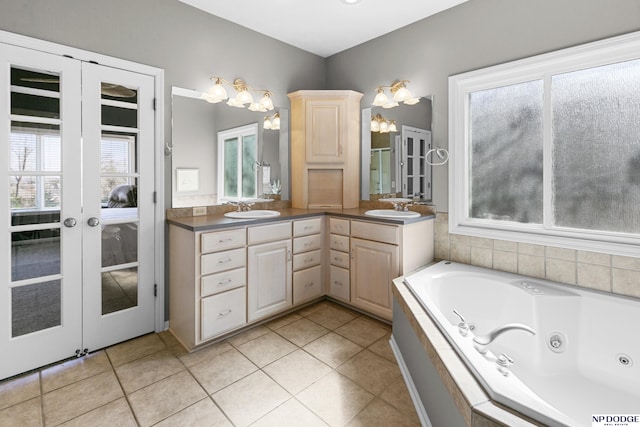 full bath featuring a wealth of natural light, french doors, and a sink