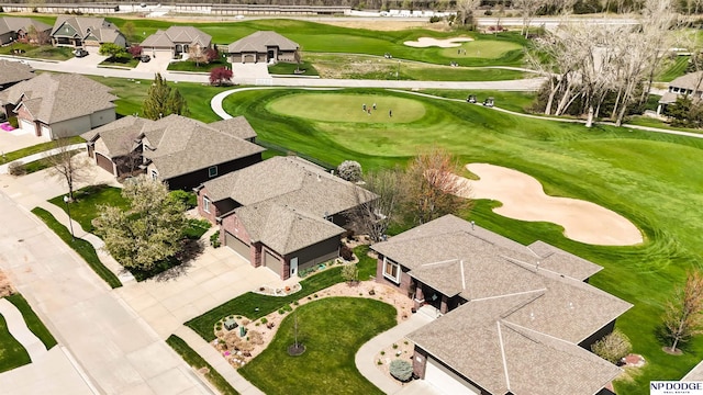 aerial view featuring view of golf course and a residential view