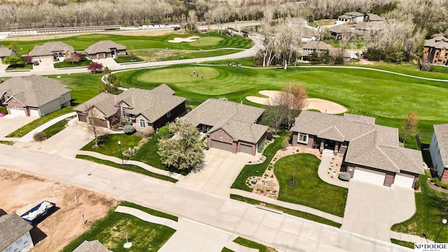 birds eye view of property with a residential view and golf course view