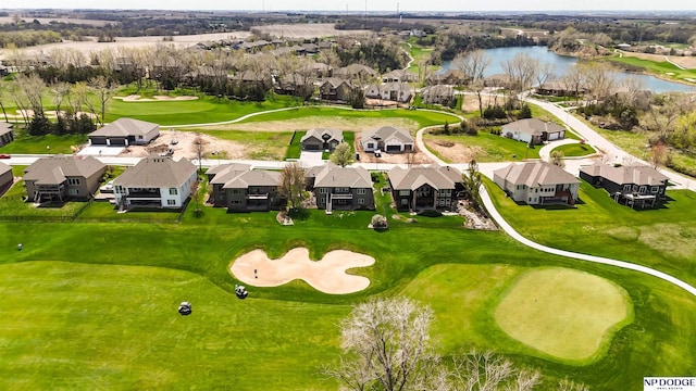 bird's eye view with golf course view, a residential view, and a water view