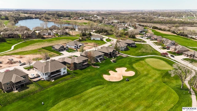 birds eye view of property featuring a residential view, a water view, and golf course view