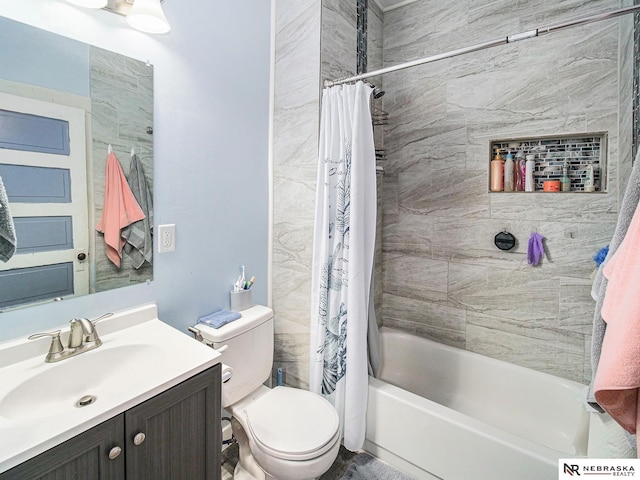 full bath with toilet, shower / bath combo, and vanity