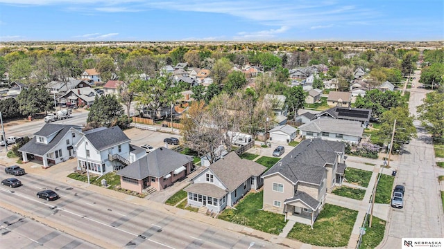 birds eye view of property with a residential view