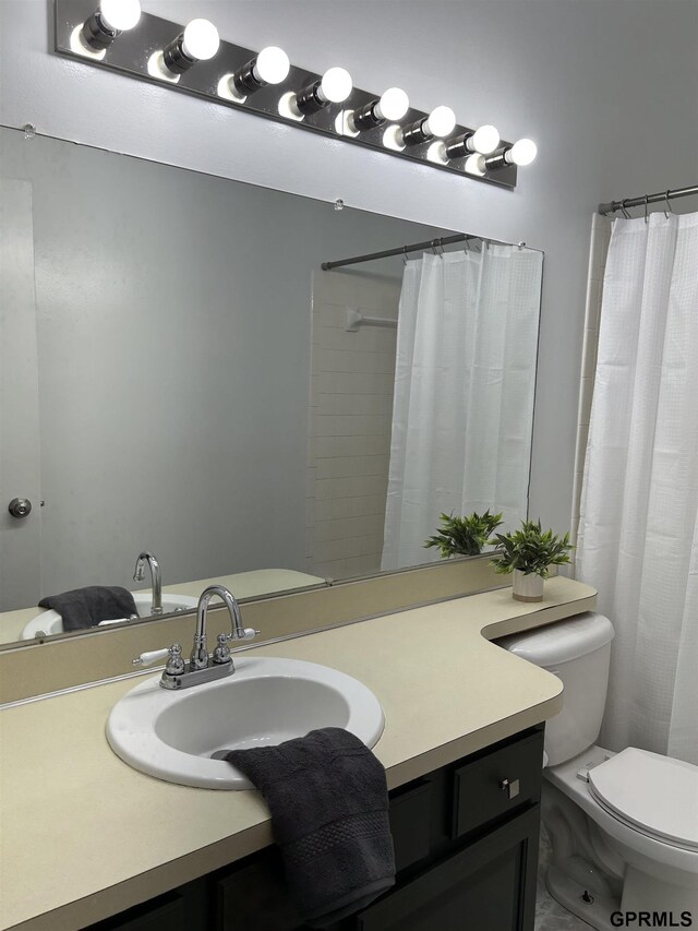 bathroom with vanity and toilet