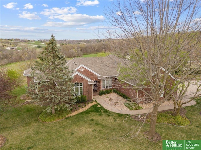 5850 Country Squire Plz, Omaha, NE 68152 - view of front facade featuring a front yard and brick siding