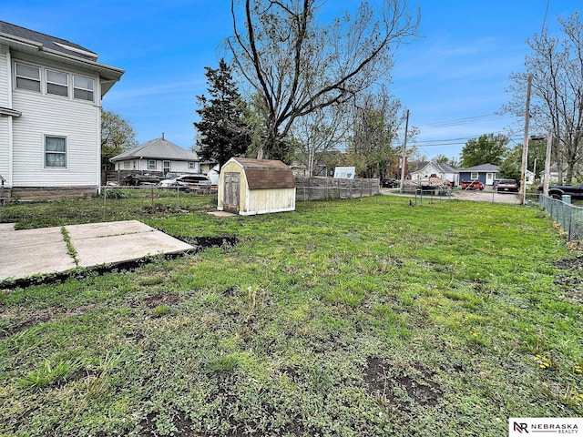1029 Rose St, Lincoln, NE 68502 - view of yard featuring a shed, a patio area, and an outdoor structure
