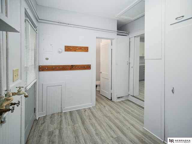 1029 Rose St, Lincoln, NE 68502 - washroom featuring light wood finished floors and attic access