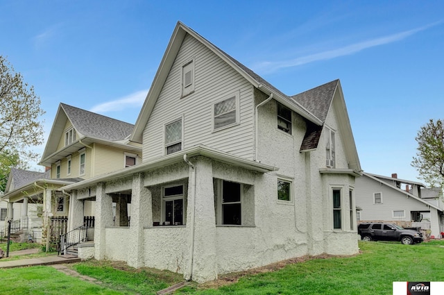 2103 A St, Lincoln, NE 68502 - view of property exterior featuring a yard and a porch