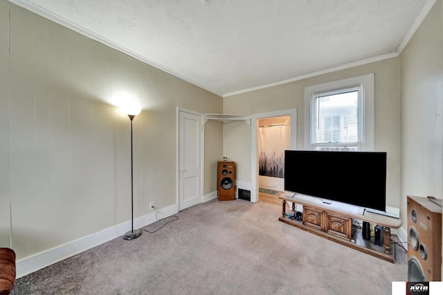 2103 A St, Lincoln, NE 68502 - living room featuring carpet floors, baseboards, and crown molding
