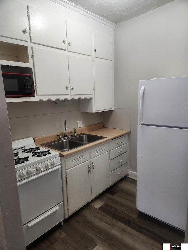 2103 A St, Lincoln, NE 68502 - kitchen featuring a sink, light countertops, white cabinets, white appliances, and dark wood-type flooring