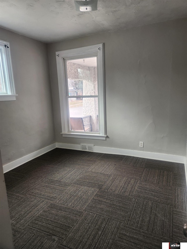 2103 A St, Lincoln, NE 68502 - carpeted empty room with baseboards and visible vents