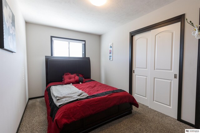 carpeted bedroom featuring a closet