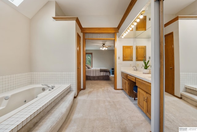 full bathroom featuring a jetted tub, double vanity, a sink, connected bathroom, and ornamental molding