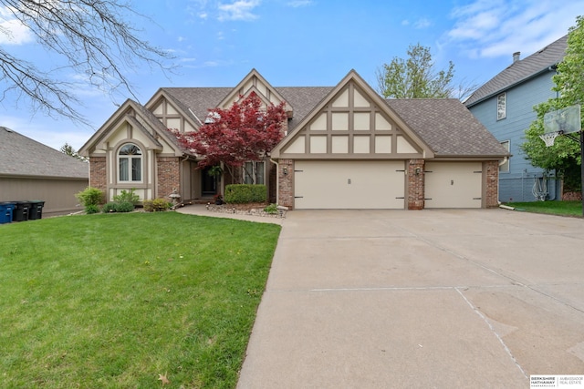 view of front of house featuring concrete driveway, brick siding, a front yard, and a garage