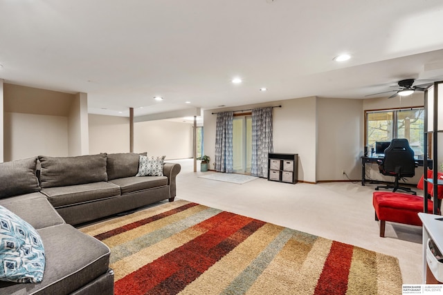living area featuring recessed lighting, a ceiling fan, baseboards, and light carpet