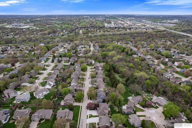 birds eye view of property with a residential view