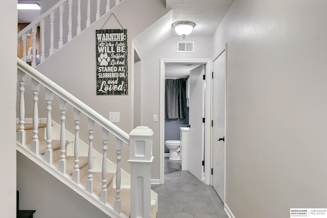 interior space with baseboards and visible vents