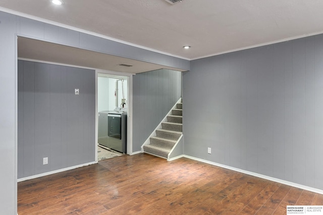 unfurnished room with crown molding, baseboards, hardwood / wood-style floors, and stairway